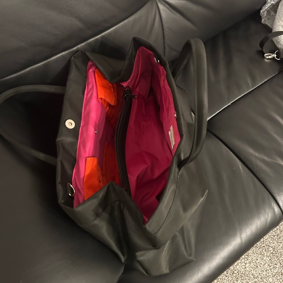 Beautiful tote used but good condition. Black satin fabric, with bright colors - Picture 2 of 2